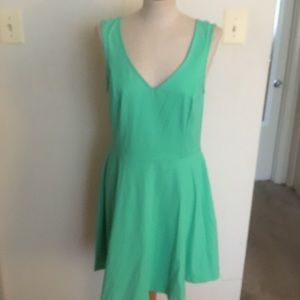 Green sleeveless above the knee dress